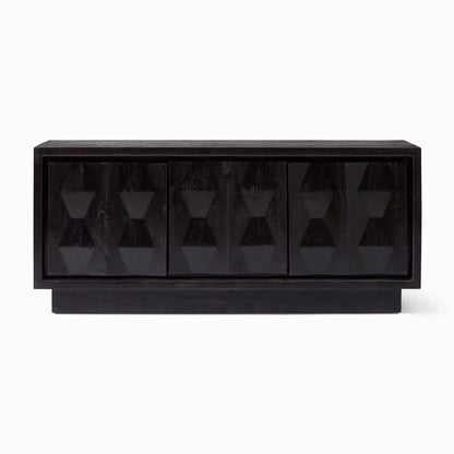 A black wooden media console with four doors featuring a carved, geometric 3D diamond pattern design.