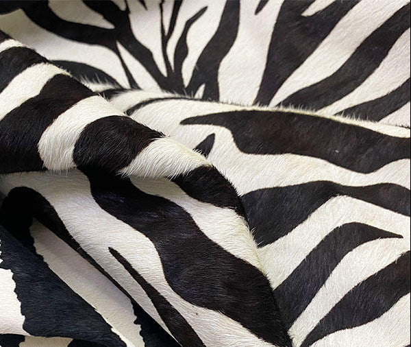 Close-up of zebra-striped fabric with a white background