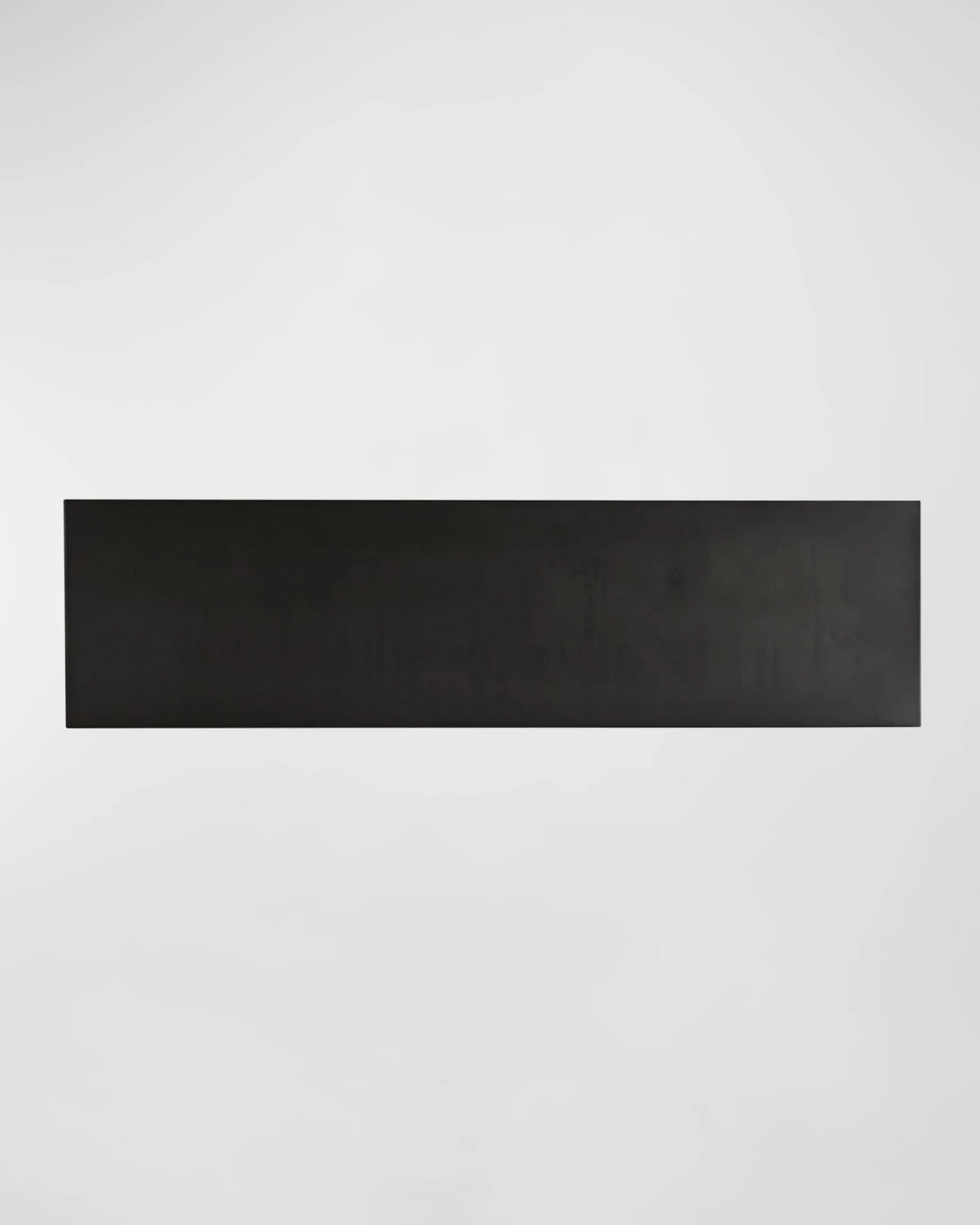 A long, black rectangular Modu Console centered on a white background.