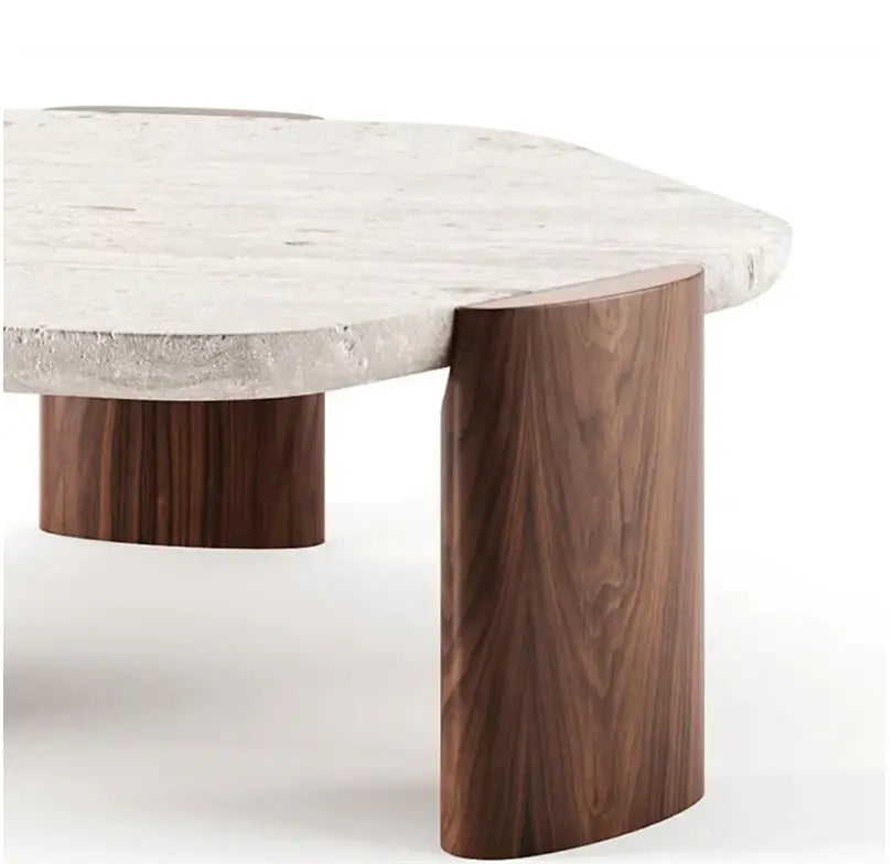 A Nordic Lob Low Table with a white asymmetrical top and cylindrical dark wood legs.