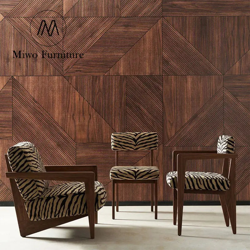 Three Savannah Stripes Dining Chairs with zebra-patterned upholstery are arranged in front of a geometric wooden wall bearing the "Miwo Furniture" logo.